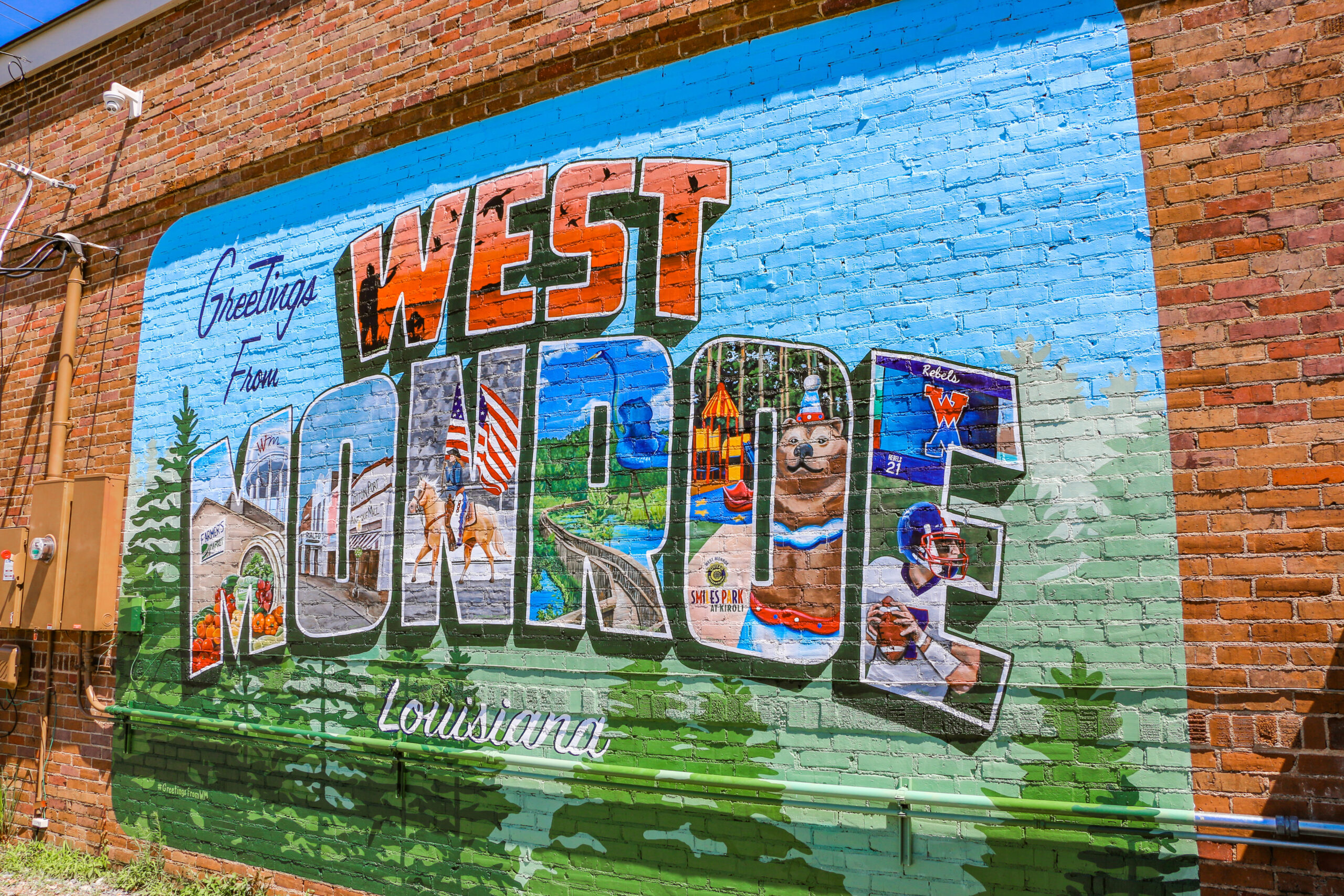 Featuring a traditional postcard style, the West Monroe Mural showcases the area’s most beloved characteristics.\